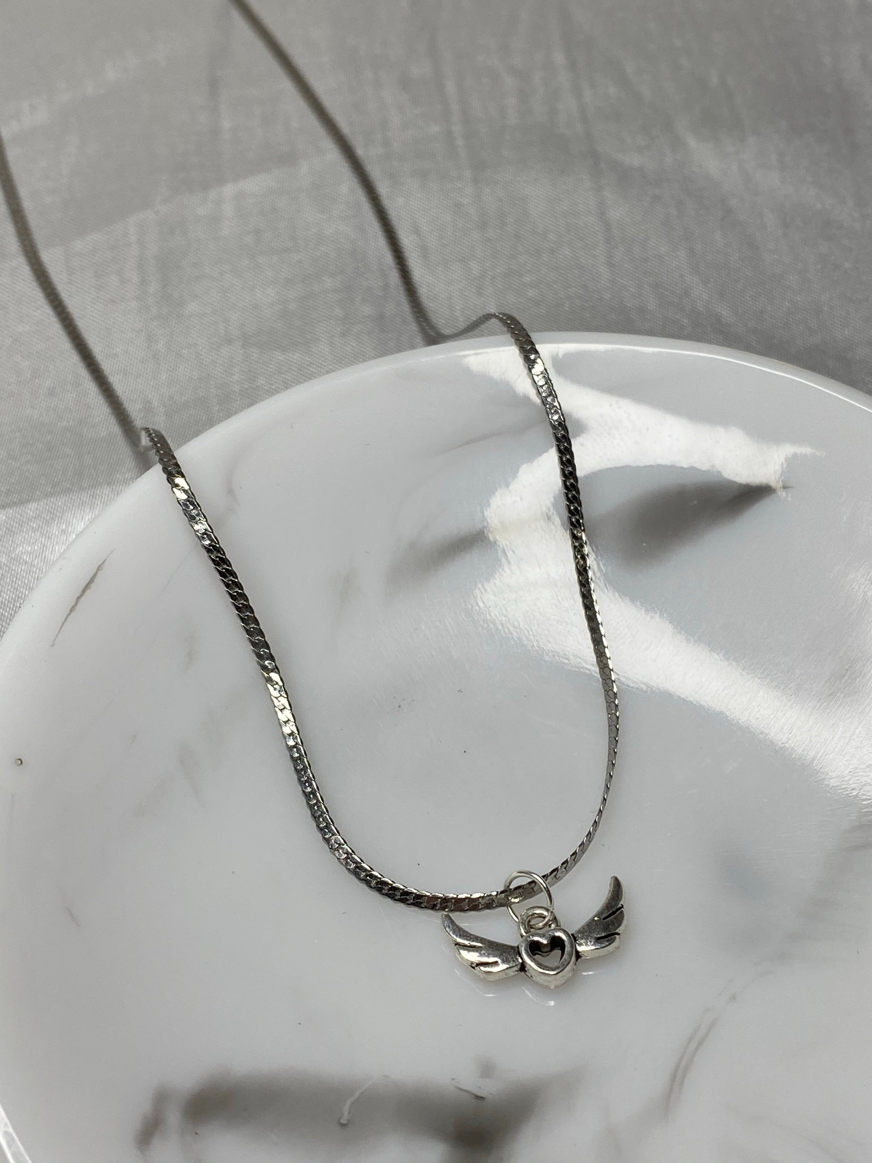 Silver flying heart necklace